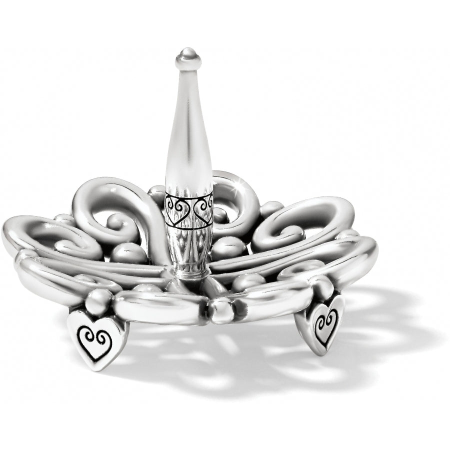 Silver plated Alcazar ring holder with ornate scrollwork and heart-shaped feet.