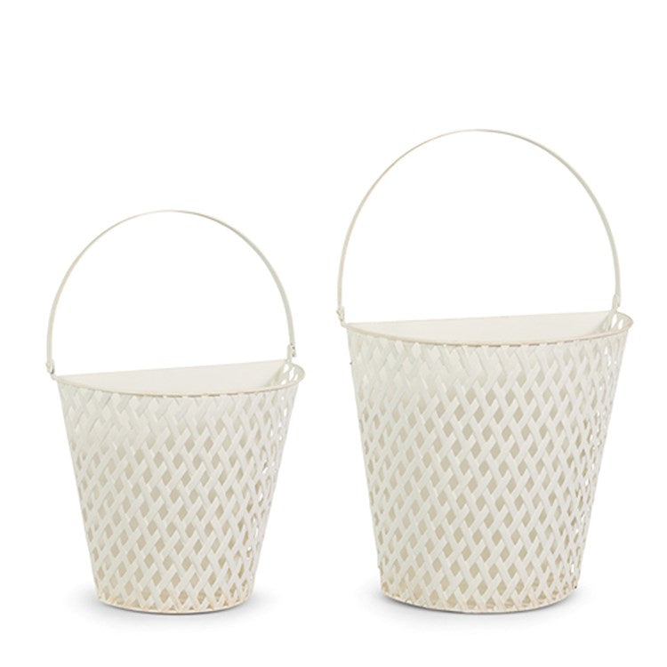 Set of two white iron decorative baskets with a lattice weave design and curved handles.