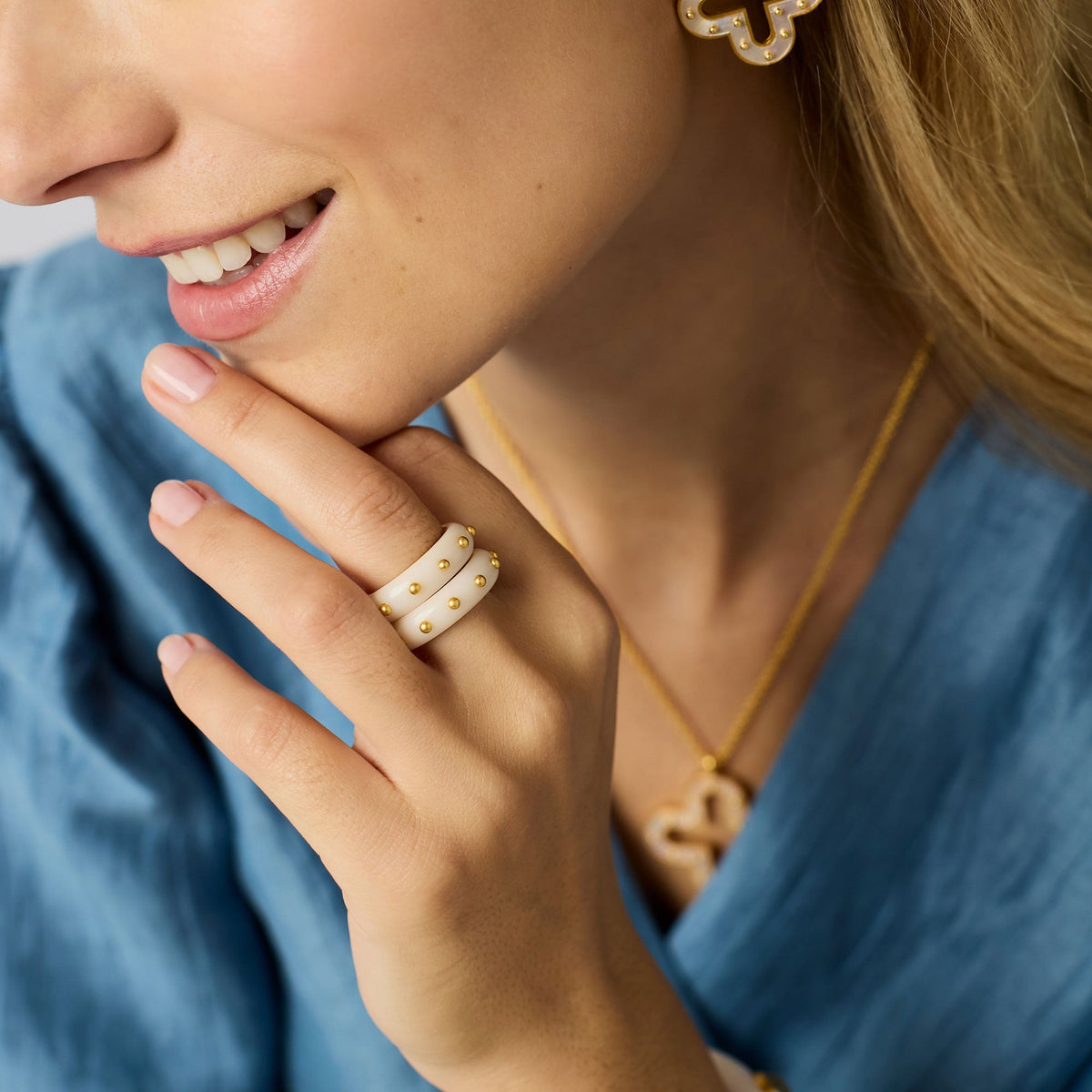 Colette stacking ring in gold-plated metal with black acetate band.
