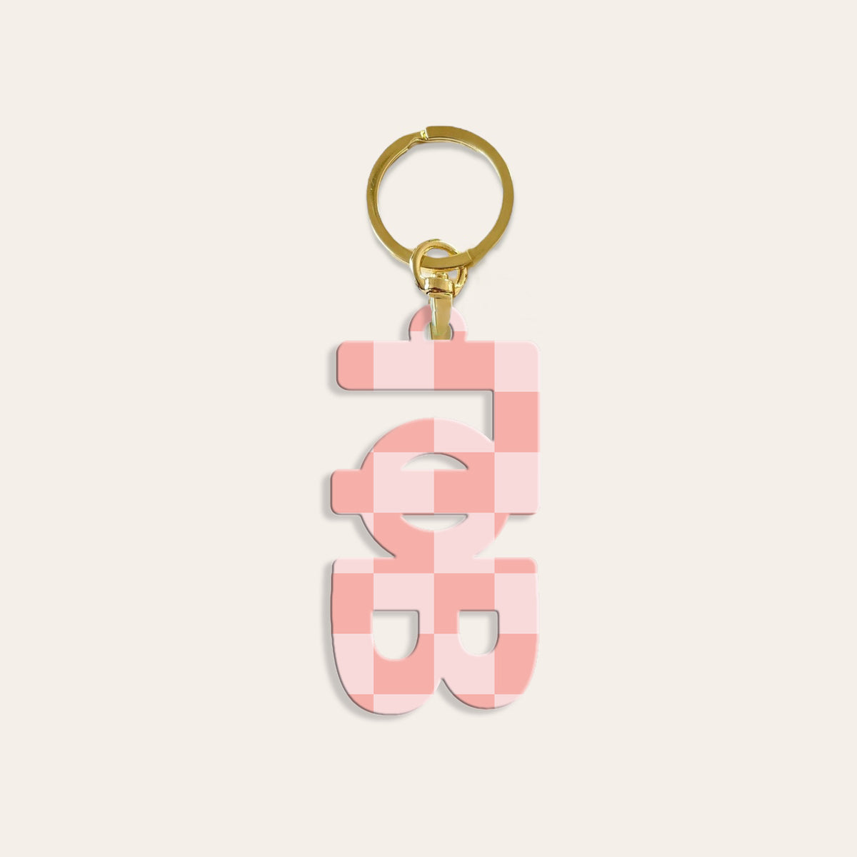 Clear acrylic sorority letter-shaped keychain with a metal ring.