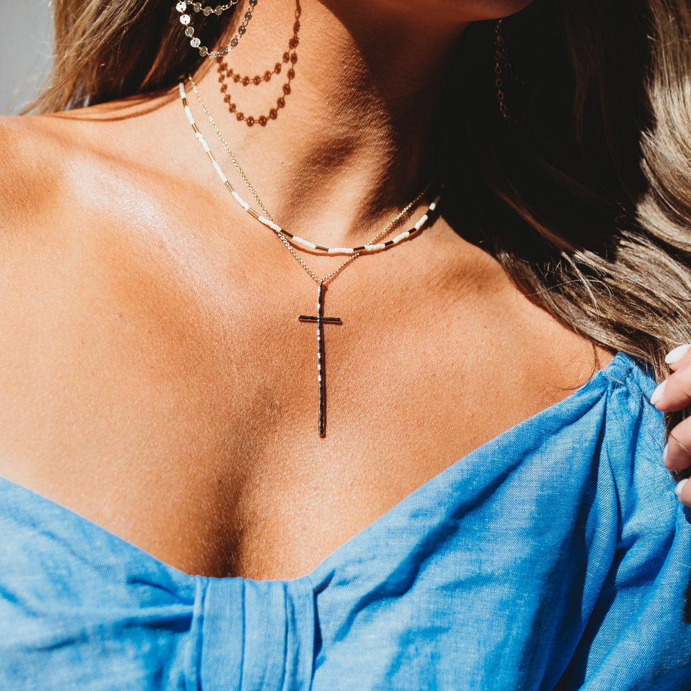 Peyton hammered thin cross pendant in silver with a textured finish.