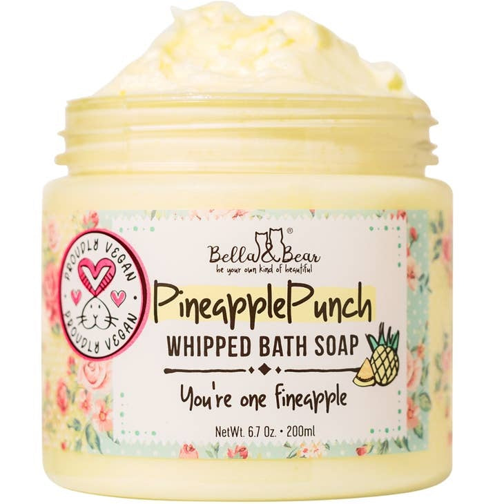 Pineapple Punch whipped bath soap in a white tub with yellow pineapple slices on top.