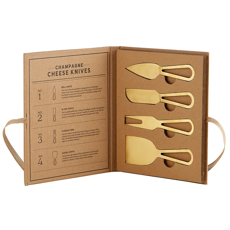 Set of four champagne gold cheese knives in a brown book-style gift box with descriptions.