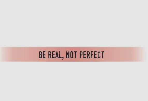Pink bracelet with the text 'BE REAL, NOT PERFECT' in black.