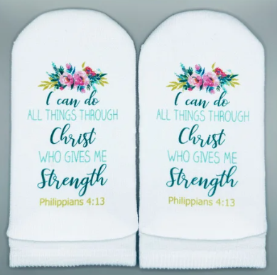 White socks with floral design and Philippians 4:13 Bible verse text.