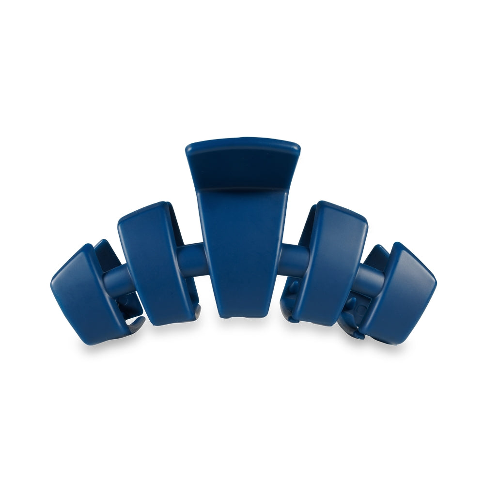 Medium-sized classic hair clip in a neutral tone with smooth plastic finish.
