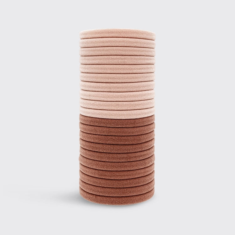 Packaging for recycled nylon hair elastics in a neutral tone.
