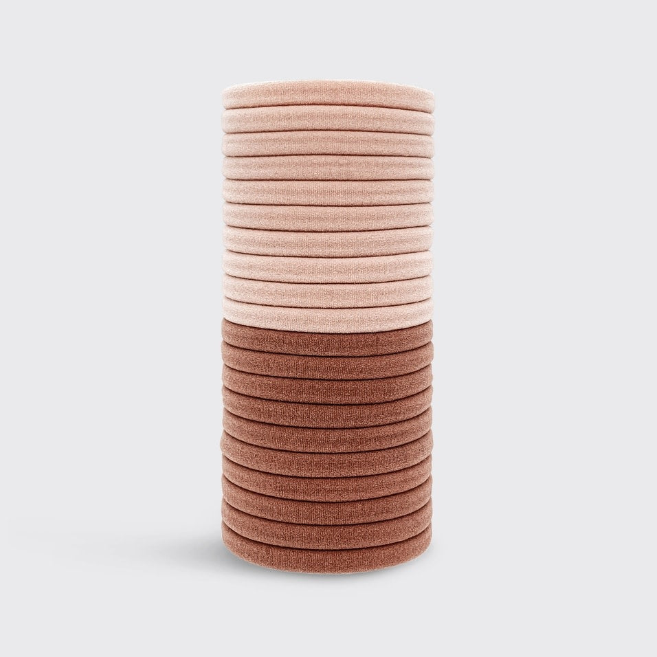 Packaging for recycled nylon hair elastics in a neutral tone.