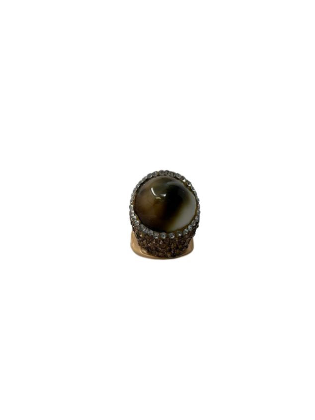 Queen of Sheba fashion ring featuring a large brown cabochon stone surrounded by crystals.