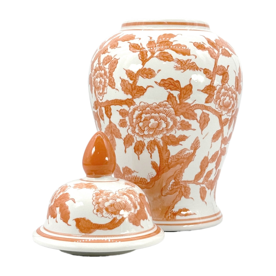 Tall ceramic ginger jar in orange and white with lotus chinoiserie pattern