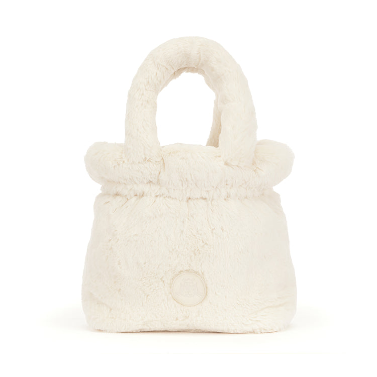 Rufferty Puppy Handbag made of soft, cream-colored faux fur with a matching top handle.
