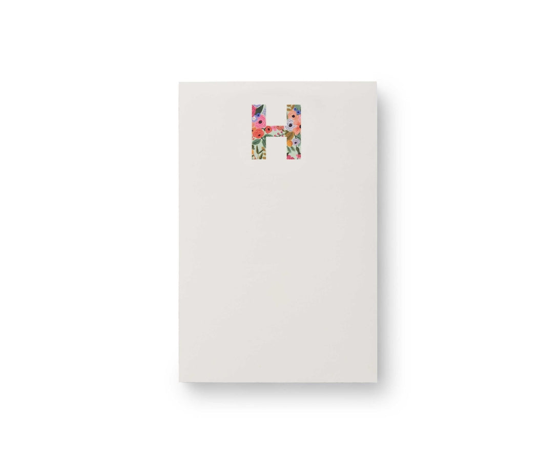 Garden Party monogram notepad with tear-off sheets in a floral pattern.