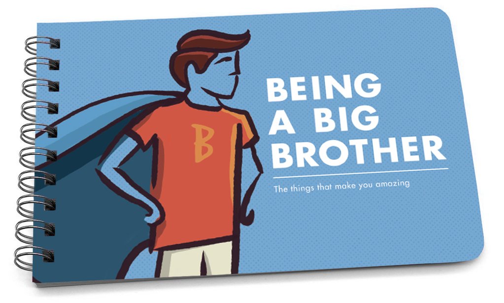 Spiral-bound handbook with a blue cover featuring a cartoon boy in a superhero cape and the text "Being a Big Brother".