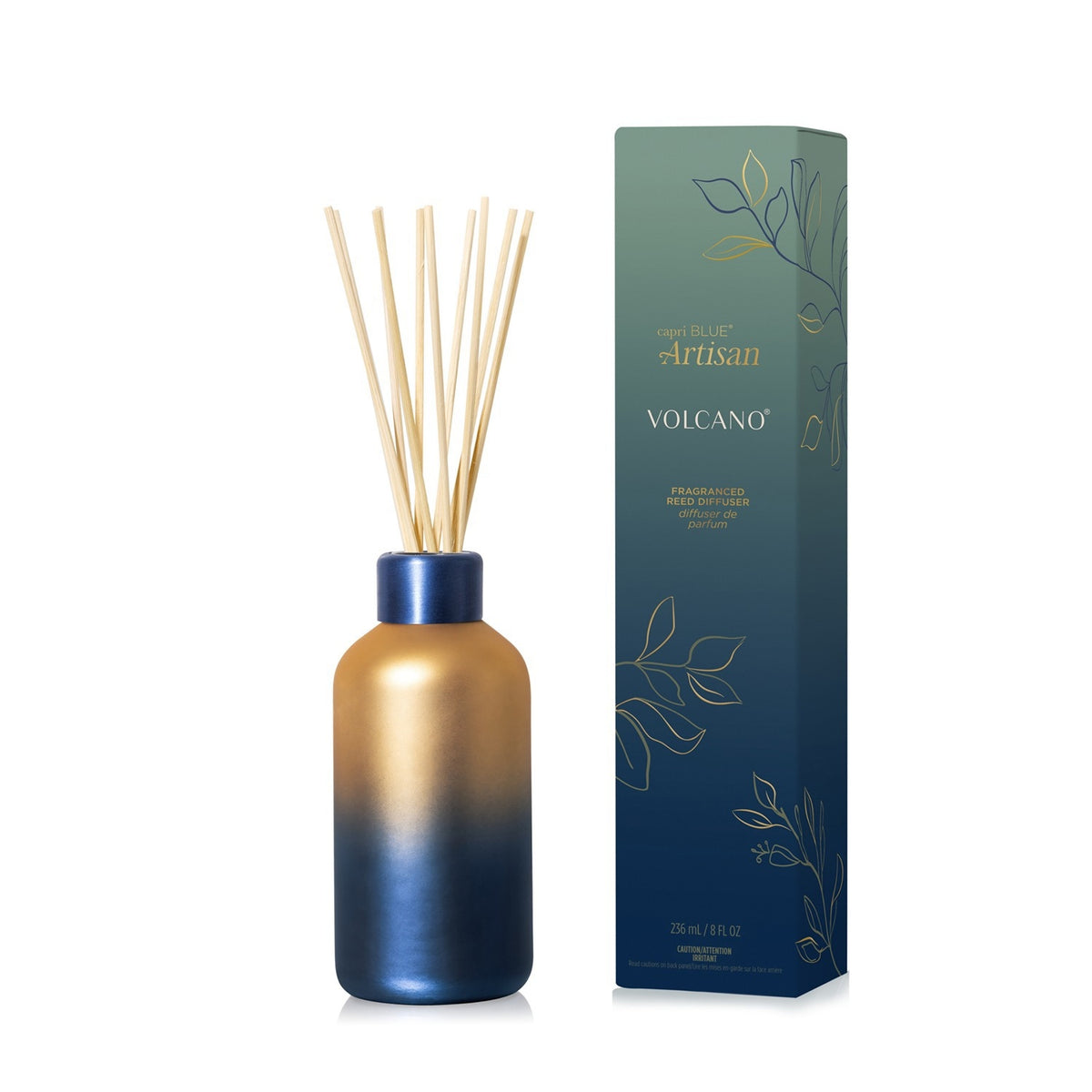 Capri Blue Volcano Artisan reed diffuser in a gold and blue ombre bottle with matching box.