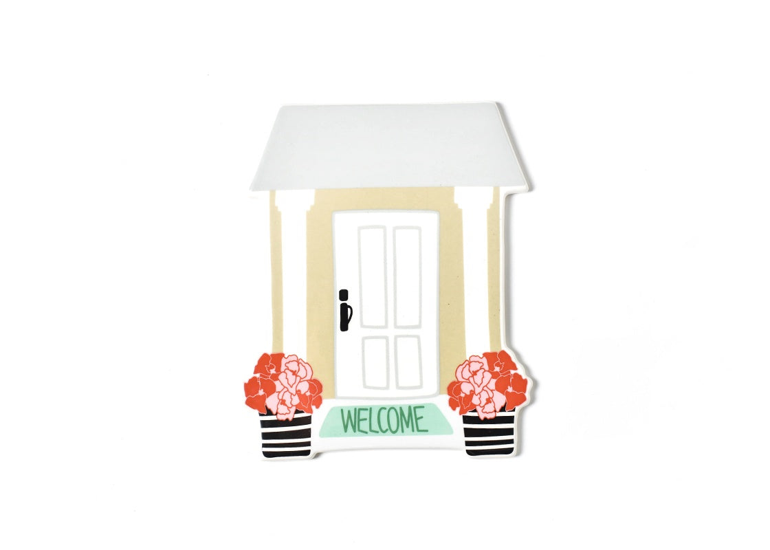 Ceramic house-shaped attachment with a white door, pink flowers, and a green 'WELCOME' mat.