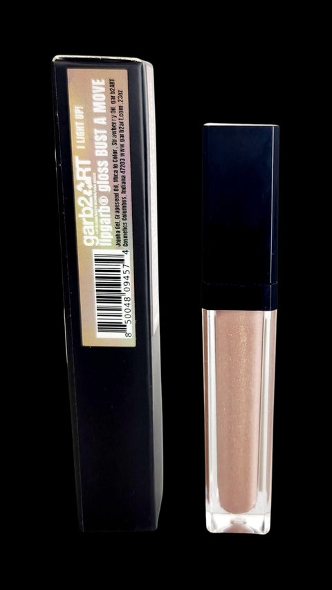 Full Lipgarb Gloss in a light shade, in a clear tube with a black cap, next to its packaging.