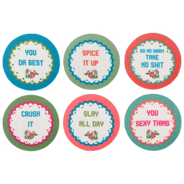 Six round embroidered travel compact mirrors with cheeky phrases and floral designs.