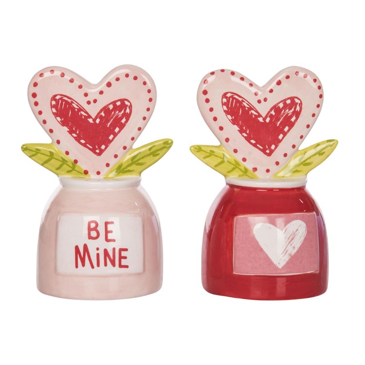 Ceramic tabletop heart-shaped figurine with a smooth matte finish.