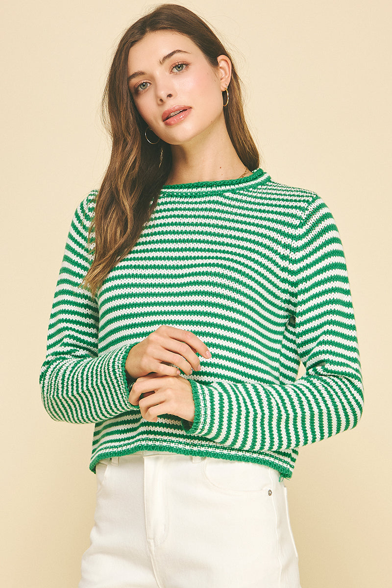 Model wearing a small Camille striped crew neck sweater in cotton acrylic blend with long sleeves.