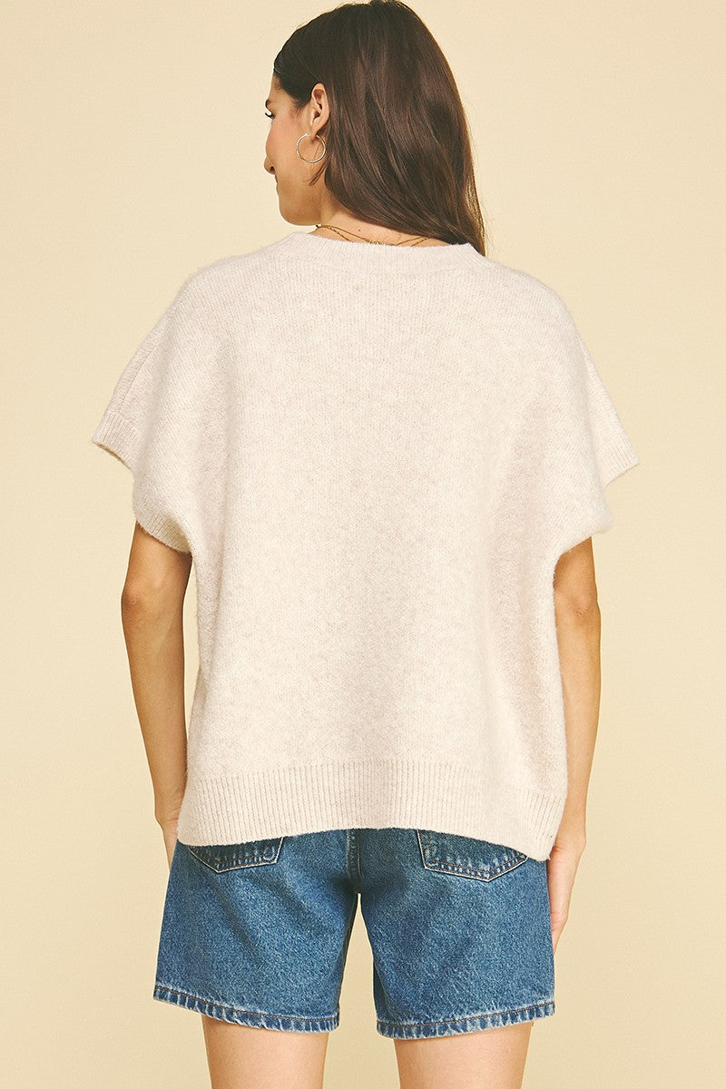 Bailey solid knit sweater in a neutral tone with cap sleeves.