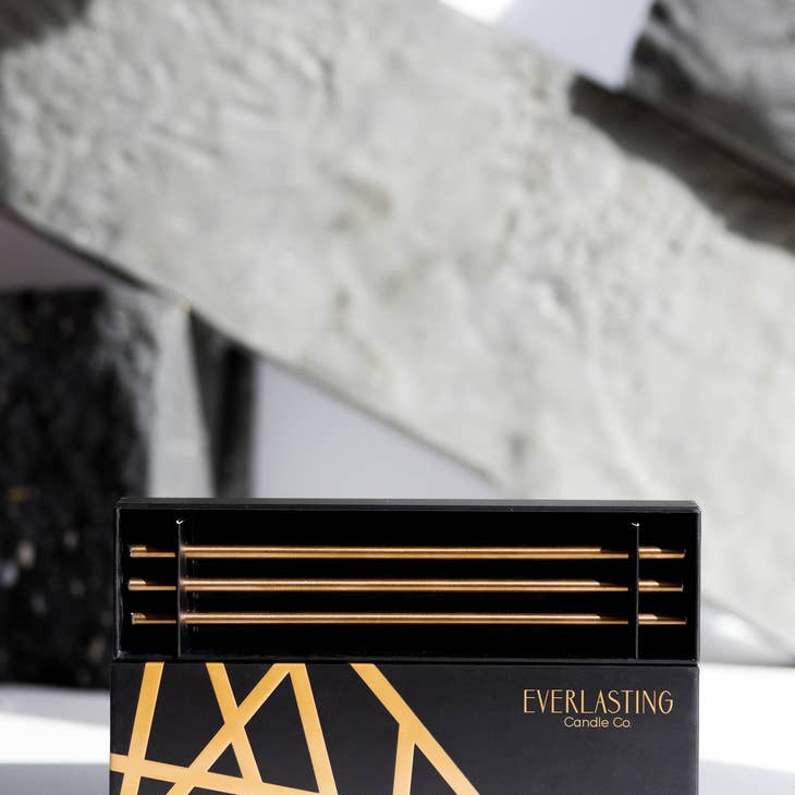 Champagne Everlasting Candles: steel candle holder with an eight-inch length that does not burn down.