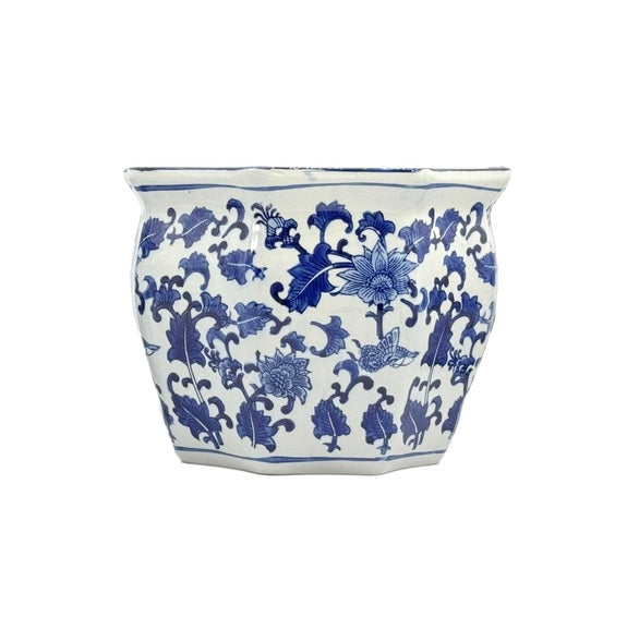Handcrafted blue and white ceramic planter pot with intricate fluting and classic porcelain-inspired silhouette.