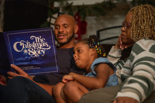 The Christmas Story Family Experience hardcover book with a festive cover featuring the title in gold lettering.
