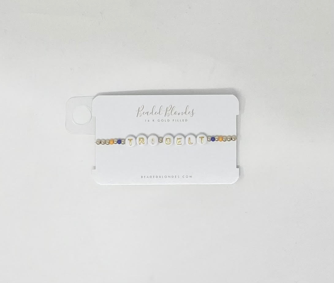 Tri Delt bracelet featuring a triangular geometric pendant on a silver-toned chain.