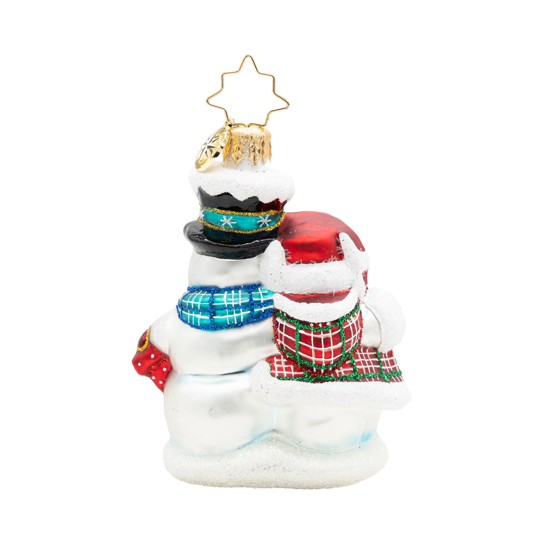 Winter Lovebirds Gem glass ornament featuring two snowmen hugging with festive hats and scarves.