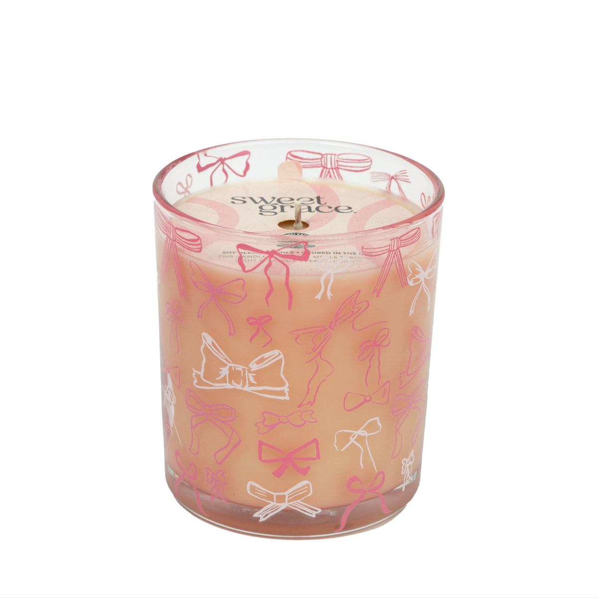 Pink Sweet Grace candle in a reusable glass vessel with an elegant bow on the lid.