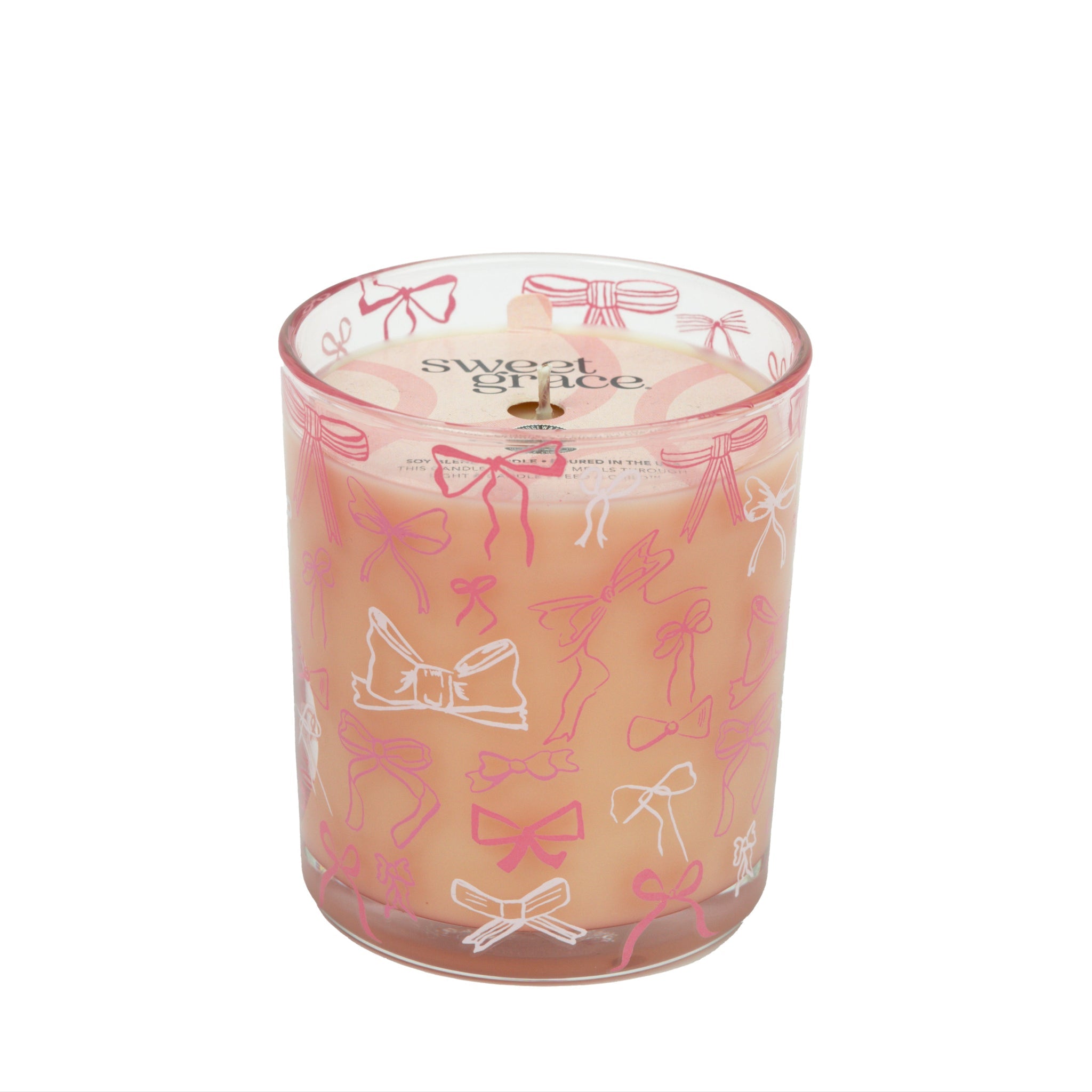 Pink Sweet Grace candle in a reusable glass vessel with an elegant bow on the lid.