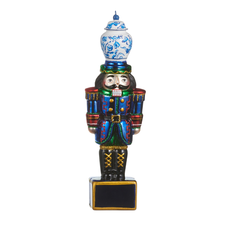 8-inch glass nutcracker ornament with a blue and white ginger jar hat and blue uniform.