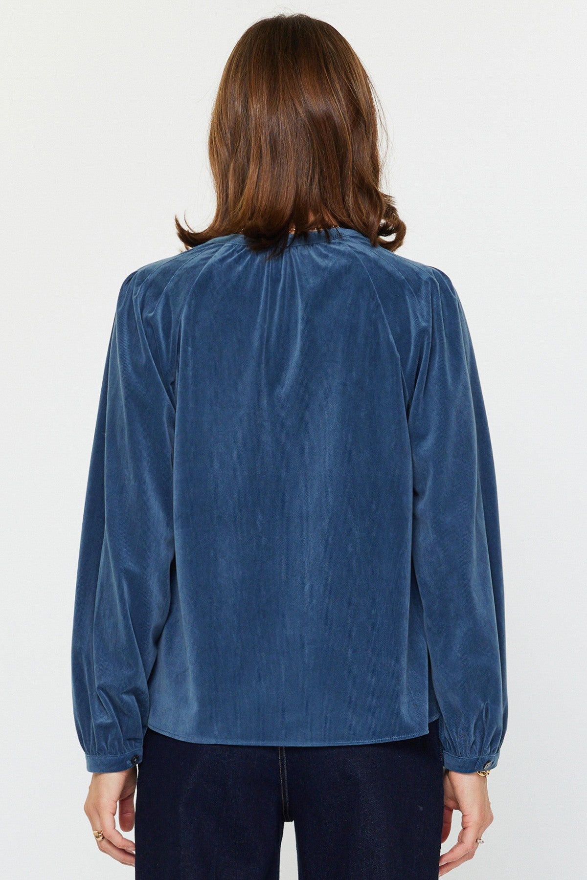 Abigail Fine corduroy long sleeve top in beige with split neck placket and shoulder pleats.