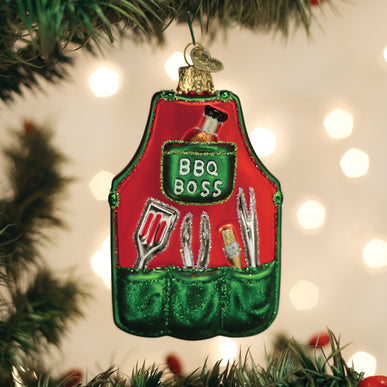 Red and green glass BBQ Apron Ornament featuring grilling tools and BBQ BOSS text.