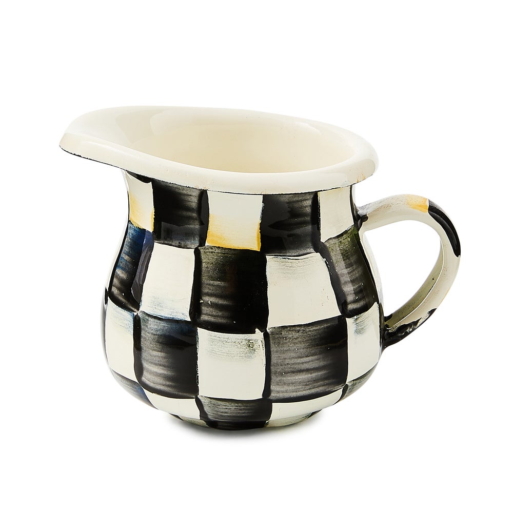 Hand-painted creamer with courtly check enamelware pattern on heavy-gauge steel.
