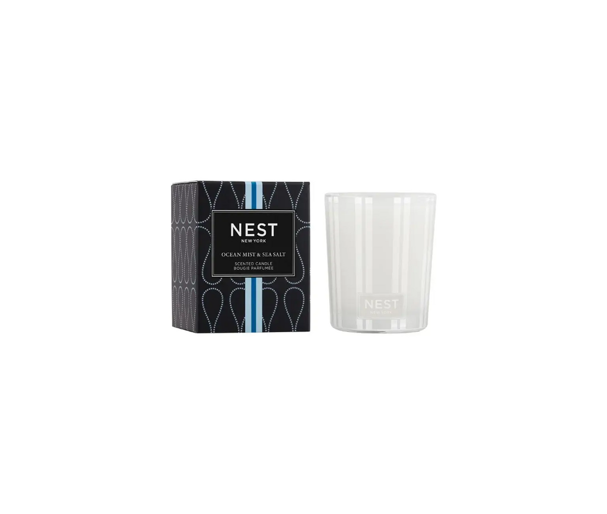Nest Votive Candle in a clear glass holder with white wax.