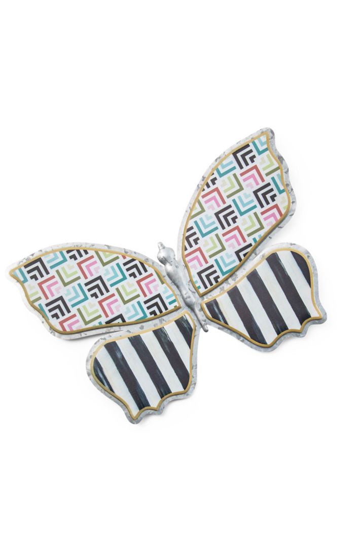 Galvanized metal butterfly wall decor with colorful painted wings in a natural outdoor silhouette.