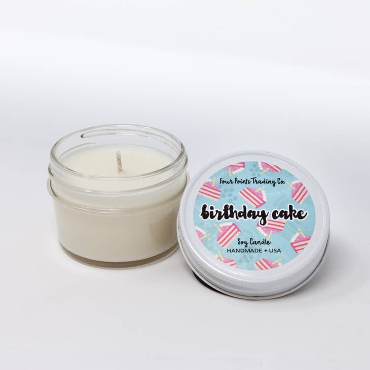 Pop Scents soy candle in a clear glass jar with white wax.