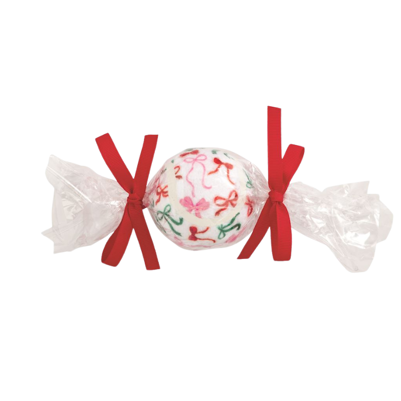 Christmas pet tennis ball with a bow pattern, wrapped in clear plastic with two red ribbons.