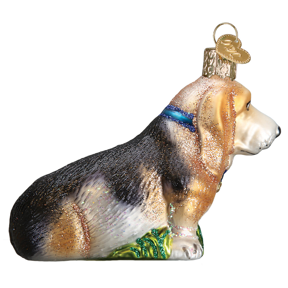 Basset Hound glass Christmas ornament with tri-color fur, blue collar, and glitter accents.