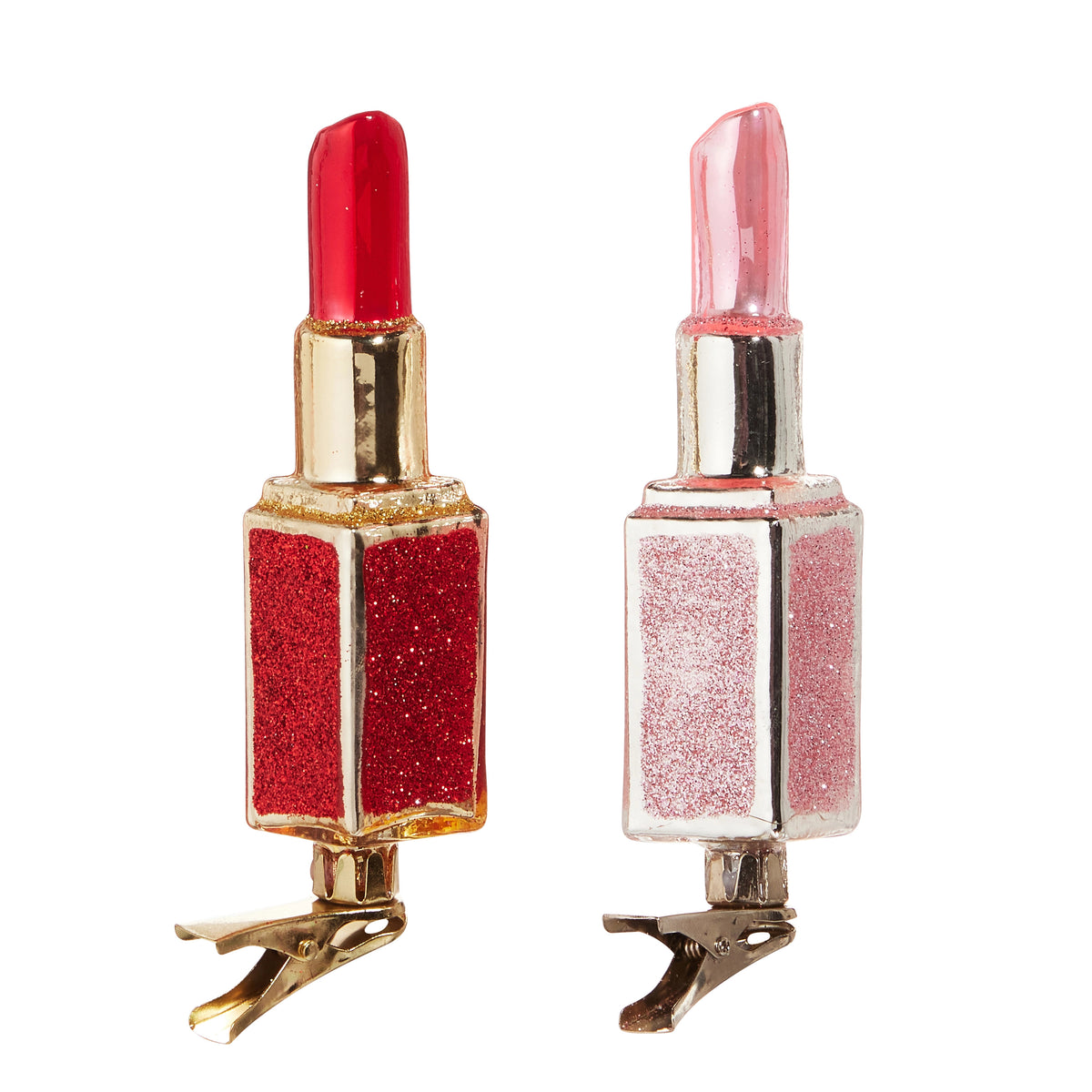 Red and pink glass lipstick clip-on Christmas ornaments with glitter accents and gold metal clips.