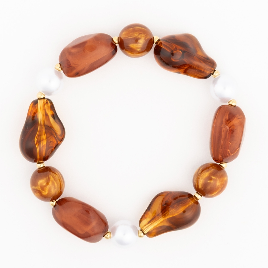 Zoe Bracelet featuring amber-toned marbled beads, white pearls, and gold-tone spacers.