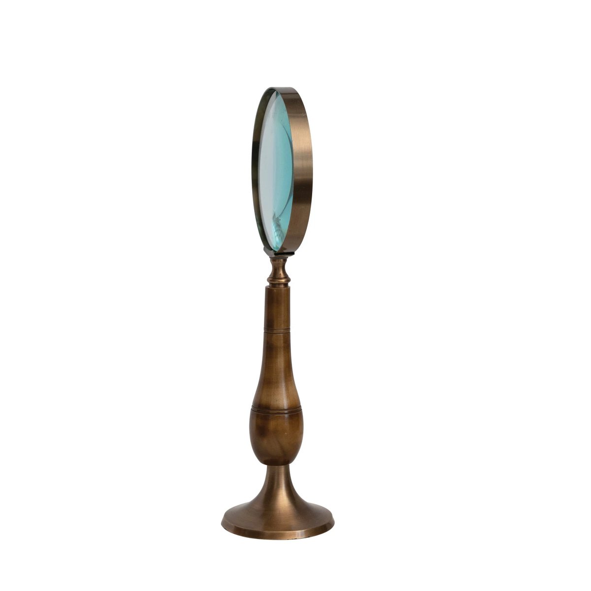 Antique brass magnifying glass on a bone stand with an antique finish.