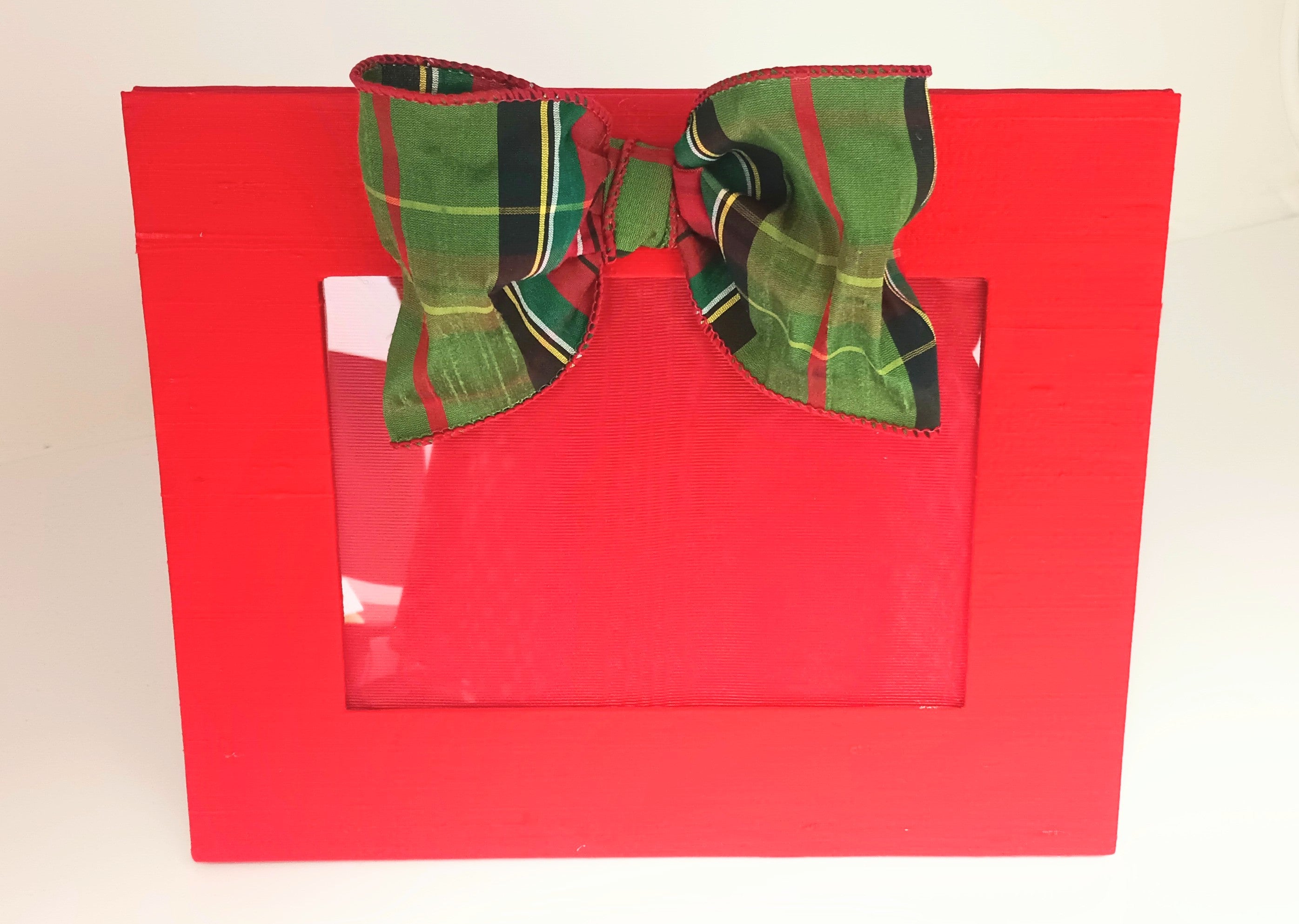 Horizontal wooden frame with tartan bow accent
