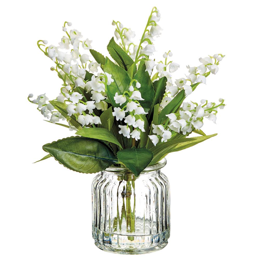 White glass vase holding nine-inch artificial lily of the valley flowers with green foliage.