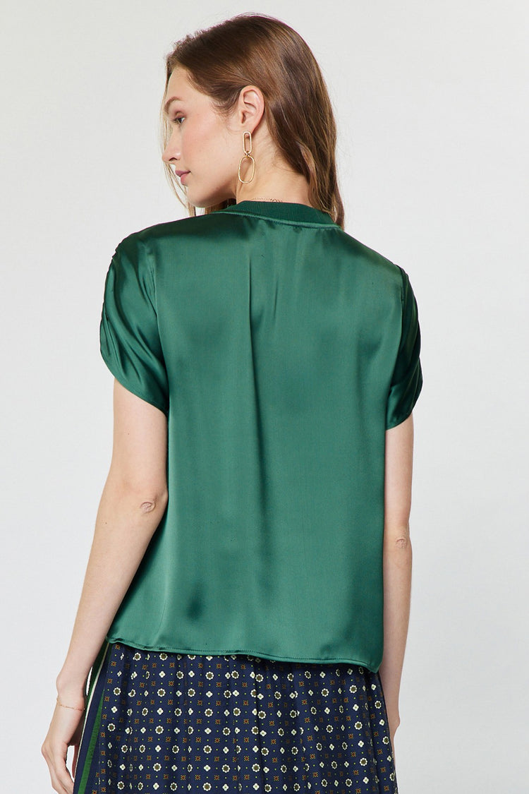 Mina blouse in polyester satin with crew neck, gathered shoulders, short sleeves, and relaxed boxy fit.
