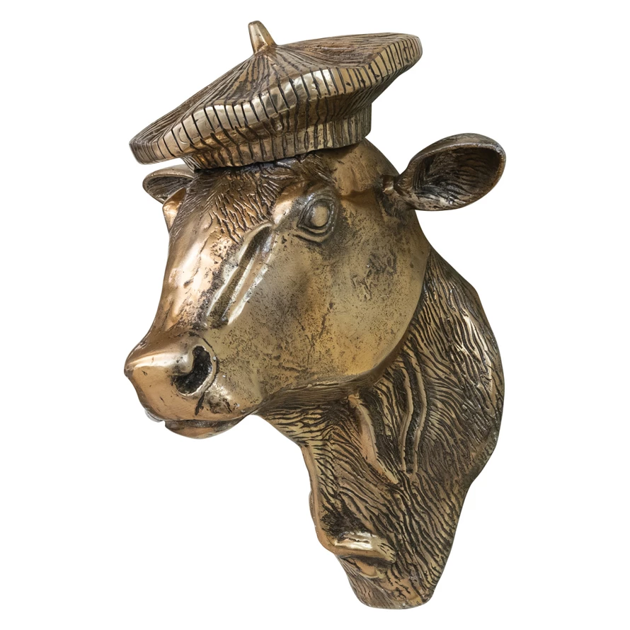 Cast aluminum cow head wall décor with a bronze finish, wearing a textured beret.
