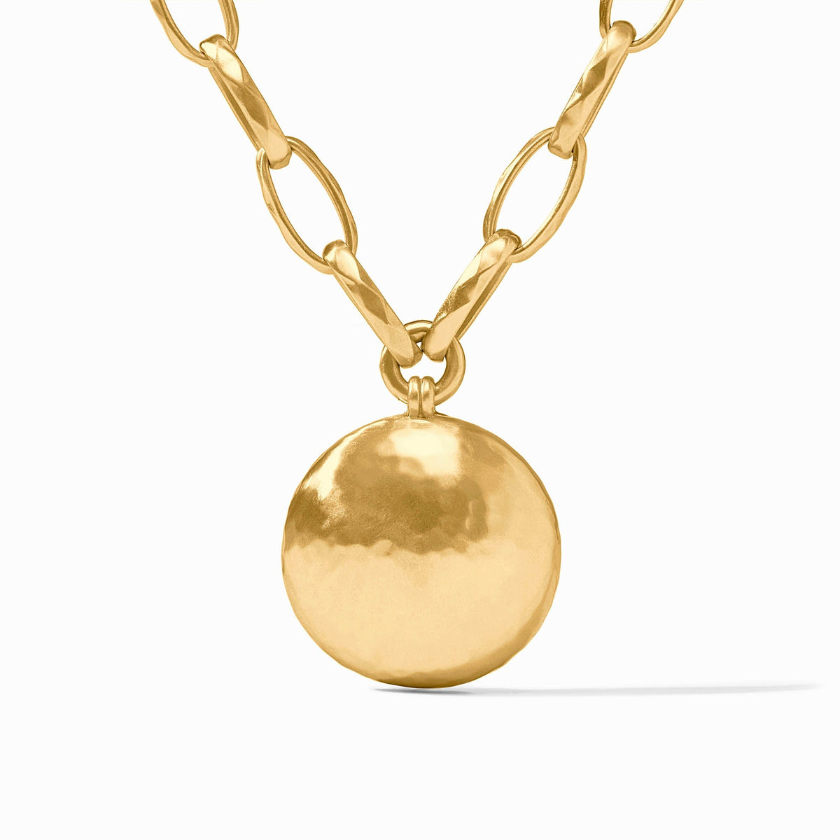 Solara Necklace in 24K gold plate featuring a hammered round pendant on an adjustable link chain.