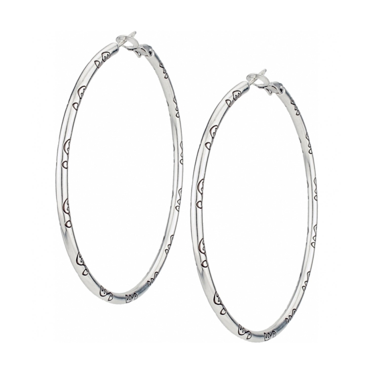 Silver plated Grande Charm Hoop Earrings with engraved heart patterns and a 2 1/2 inch drop.