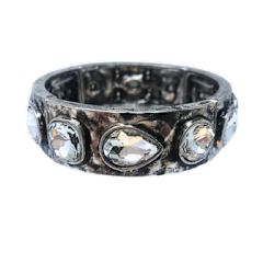 Silver metal stretch bracelet featuring round and teardrop rhinestones.